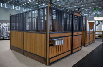 Equestrian stall booth with a wooden and metal design showcased at Spoga Horse 2025.